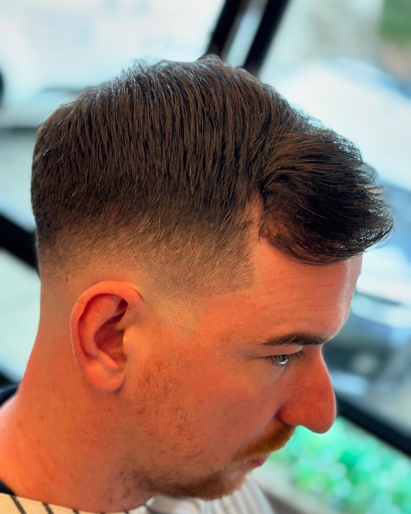 Classic taper fade with styled finish at KB Barbering
